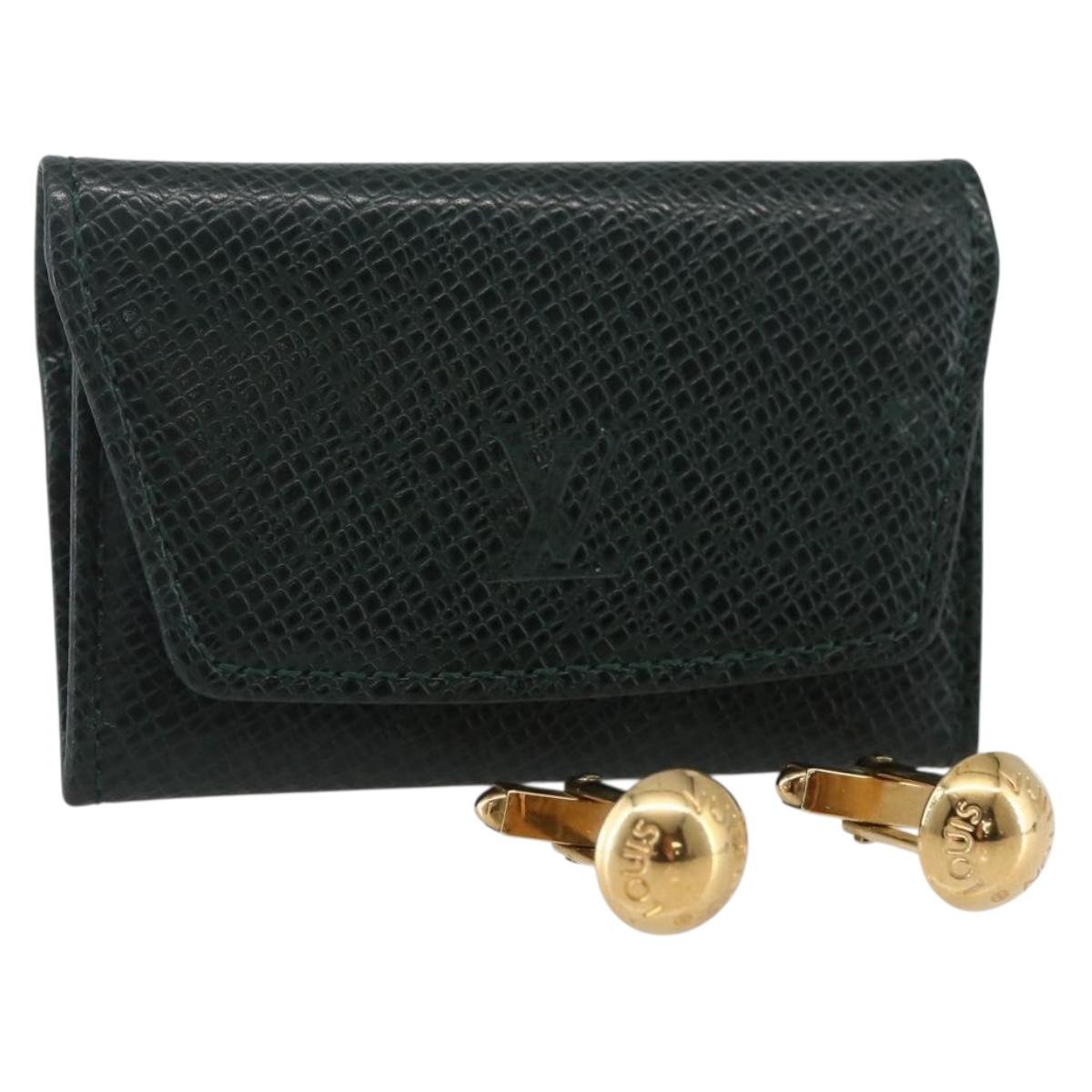 LOUIS VUITTON Taiga Buton De Manchette Cuffs metal Gold Tone LV Auth 156221