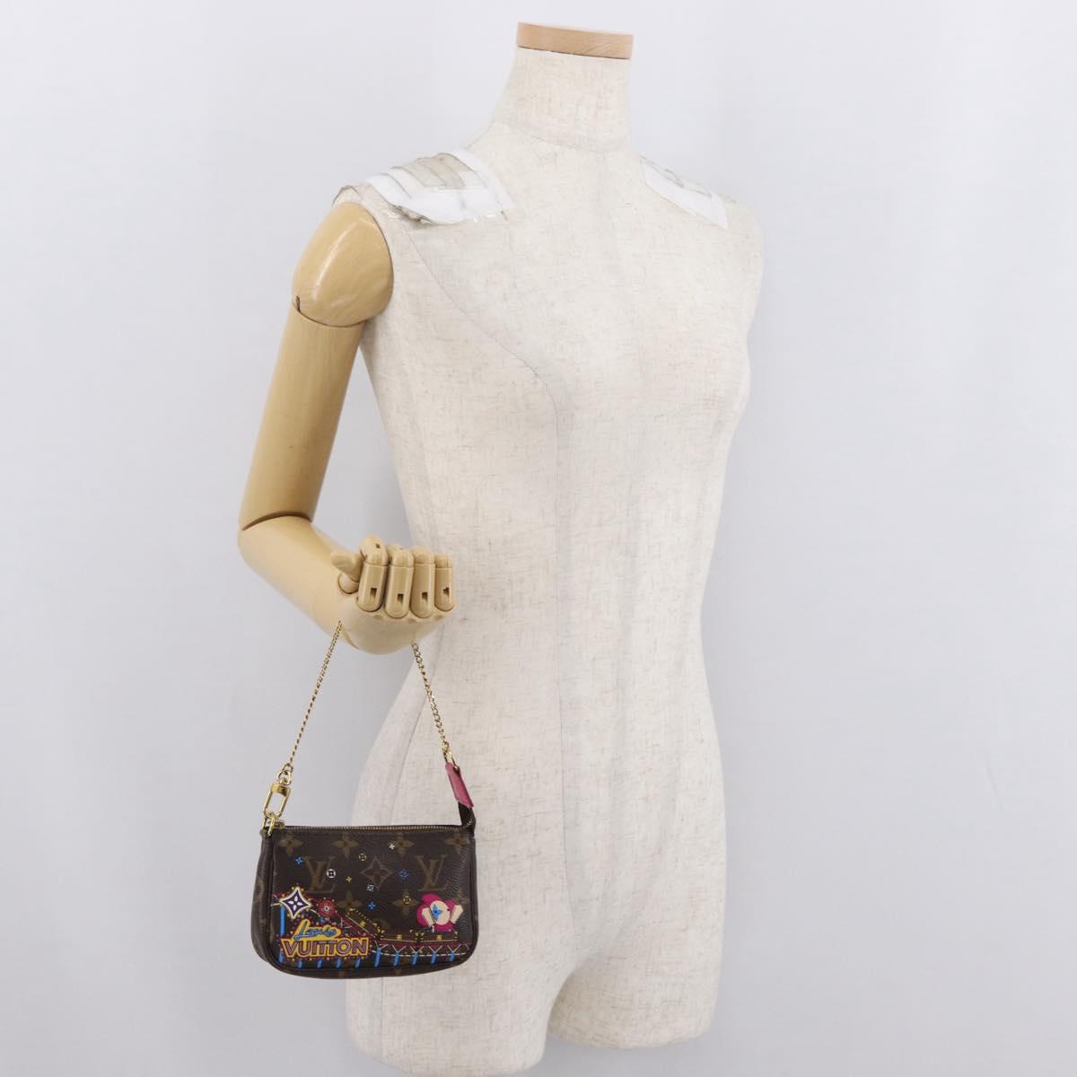 LOUIS VUITTON Monogram Vivienne Mini Pochette Accessoires M69752 Auth 168215SAM