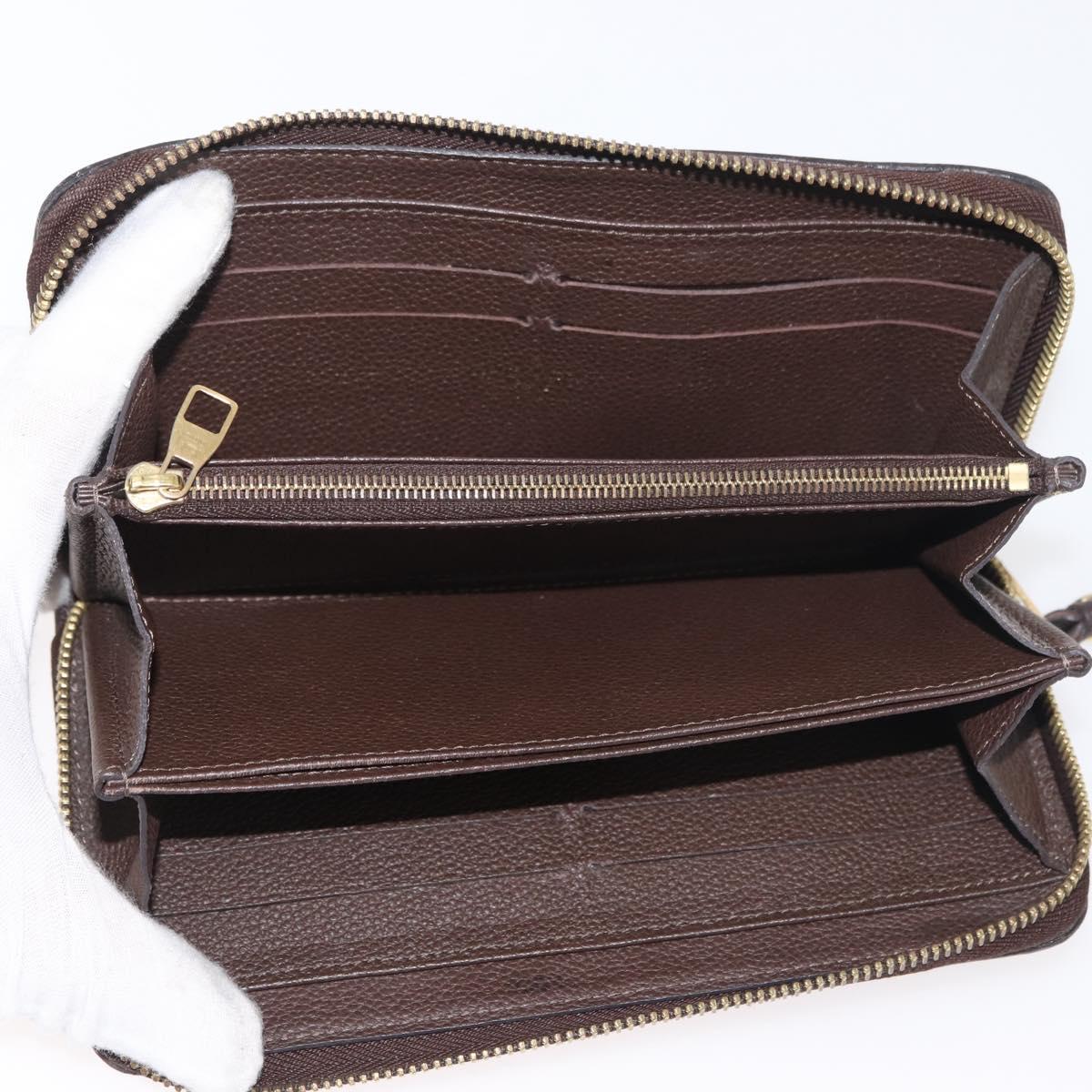 LOUIS VUITTON Monogram Empreinte Zippy Wallet Dark Brown M60548 LV Auth 178383A