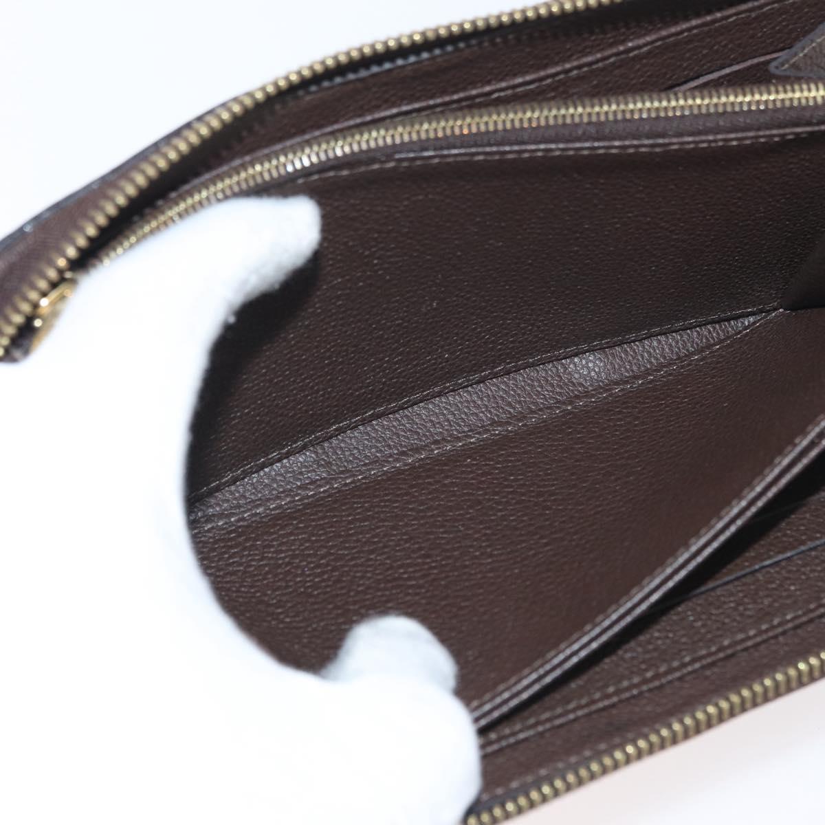LOUIS VUITTON Monogram Empreinte Zippy Wallet Dark Brown M60548 LV Auth 178383A