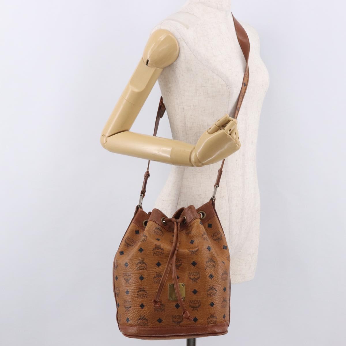 MCM Vicetos Logogram Drawstring Bag PVC Leather Brown Gold Auth 186663