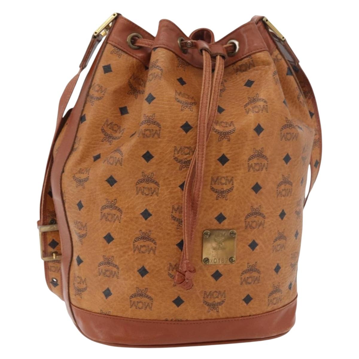 MCM Vicetos Logogram Drawstring Bag Bag PVC Leather Brown Gold Auth BA12441A