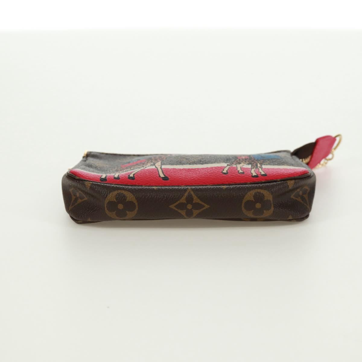 LOUIS VUITTON Monogram Giraffe Mini Pochette Accessoires M62087 LV Auth 172028M
