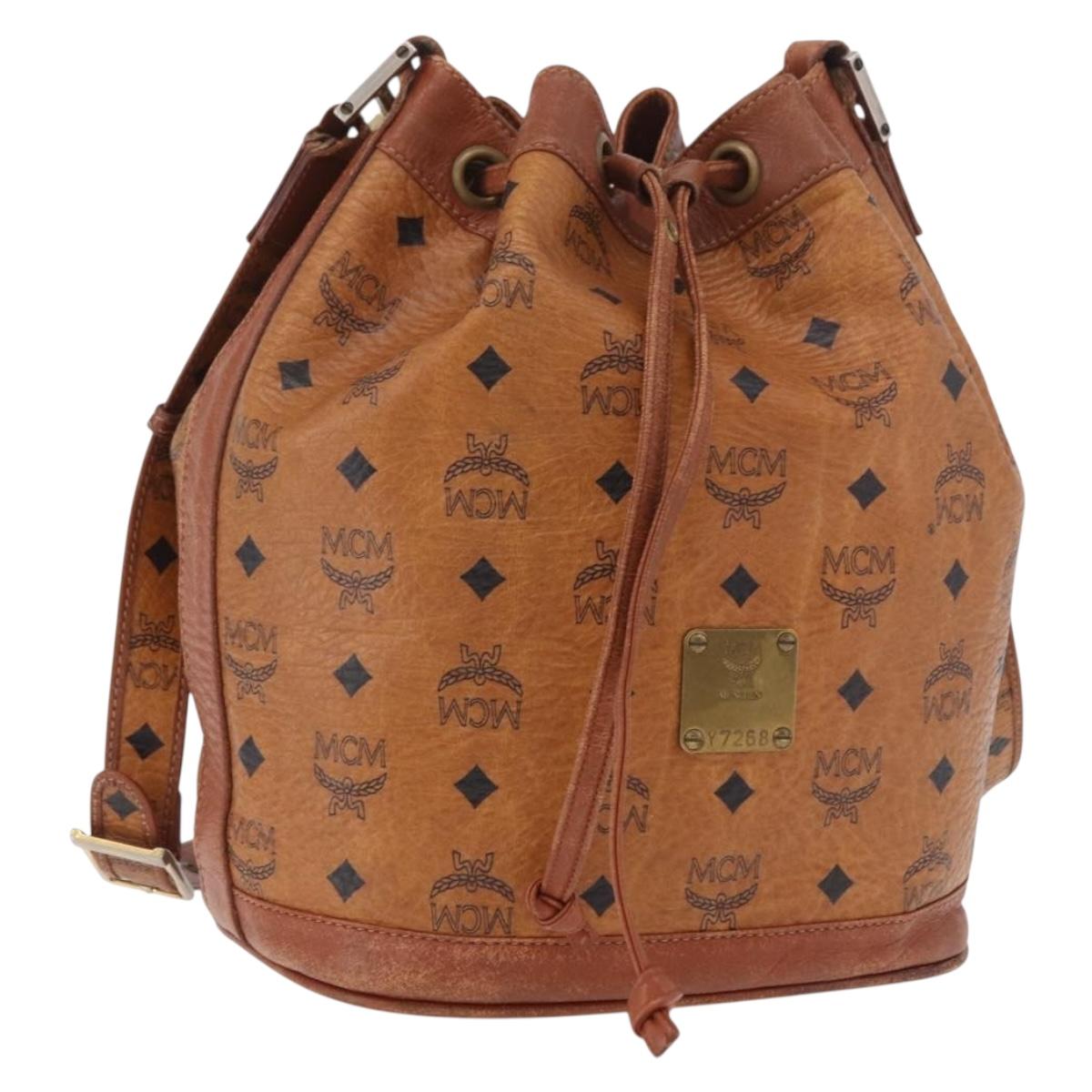 MCM Vicetos Logogram Drawstring Bag PVC Leather Brown Gold Auth 186663