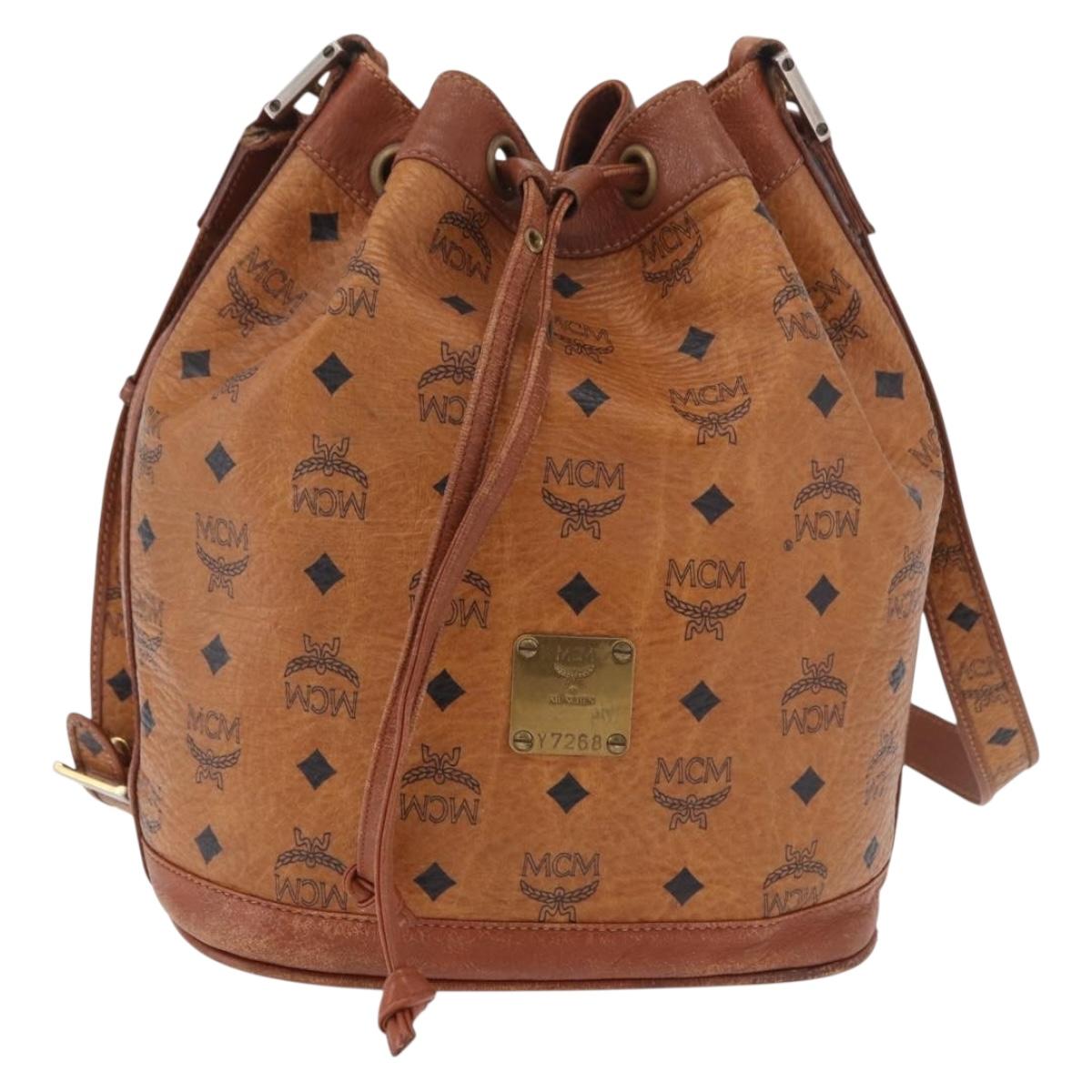 MCM Vicetos Logogram Drawstring Bag PVC Leather Brown Gold Auth 186663