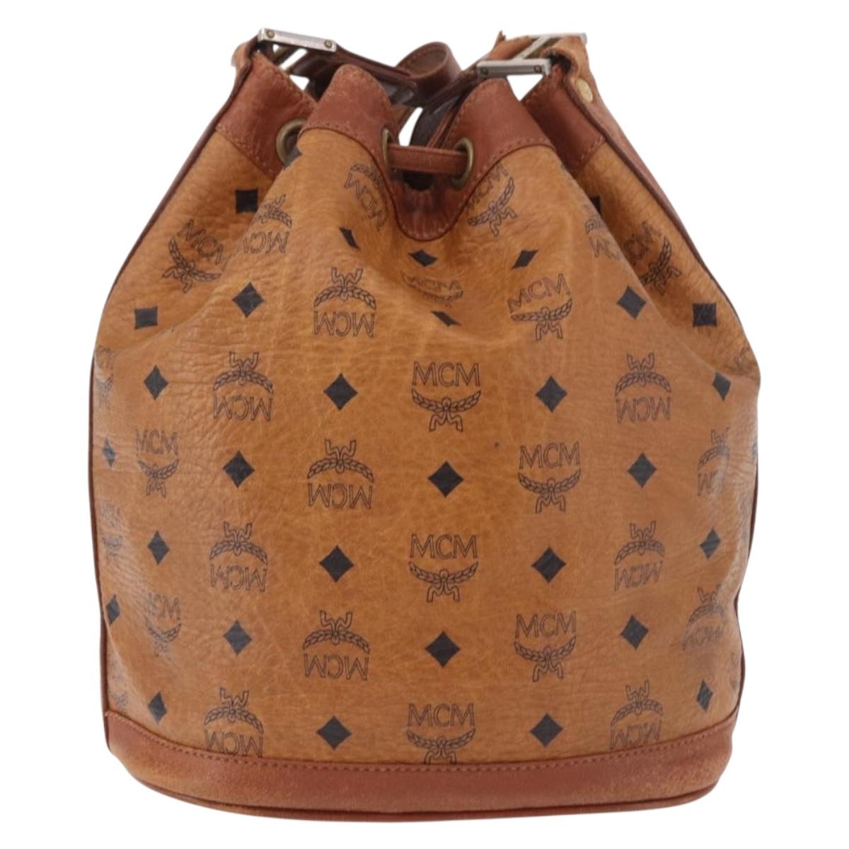 MCM Vicetos Logogram Drawstring Bag PVC Leather Brown Gold Auth 186663