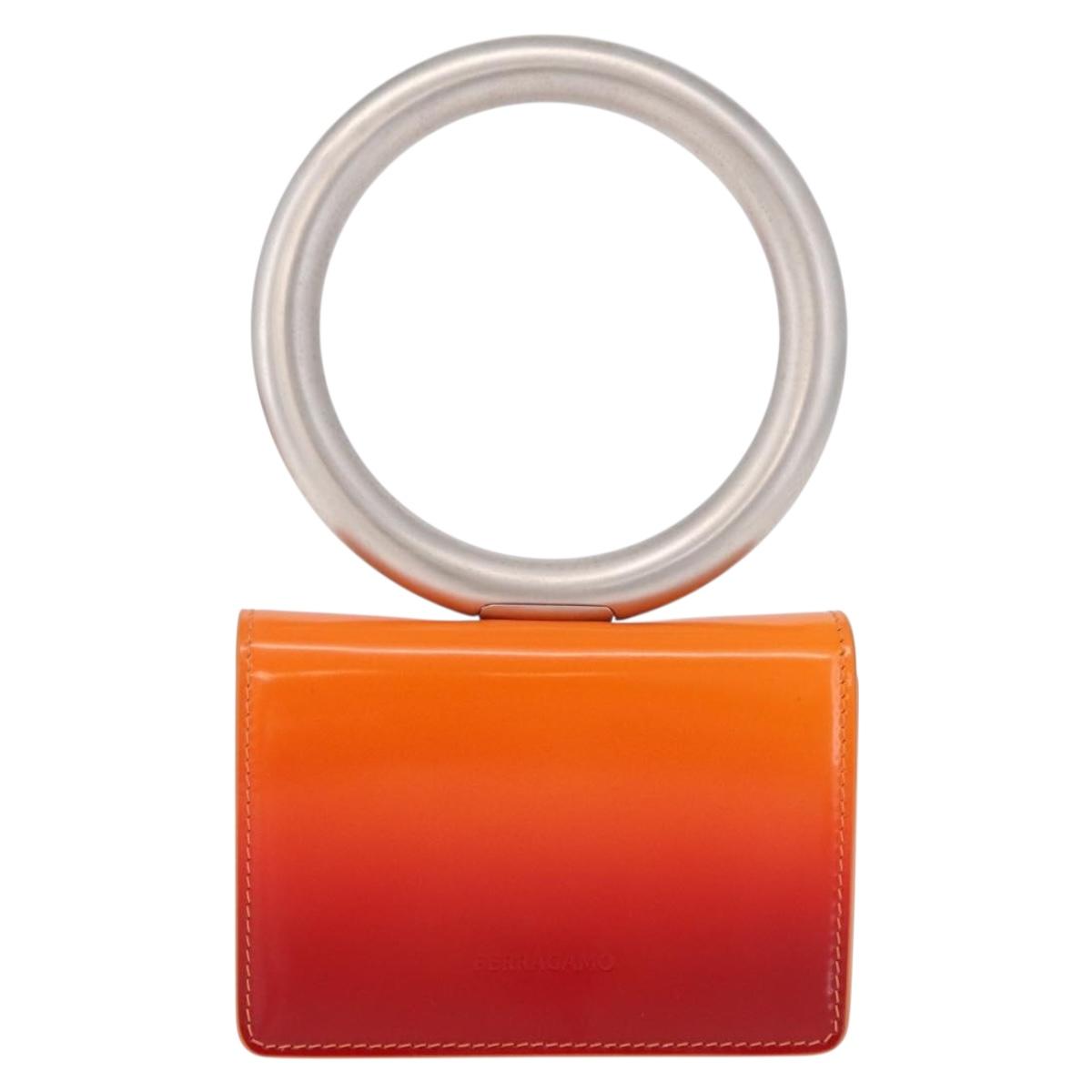 Salvatore Ferragamo Metal Hand Pouch Patent leather Orange Silver Auth 208342M