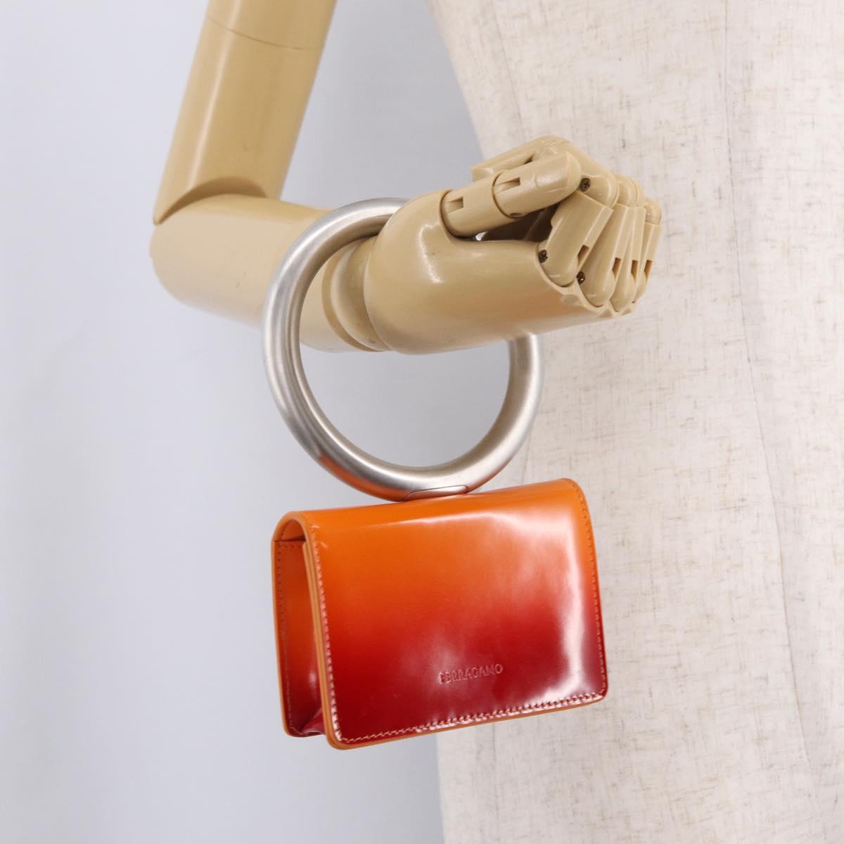 Salvatore Ferragamo Metal Hand Pouch Patent leather Orange Silver Auth 208342M