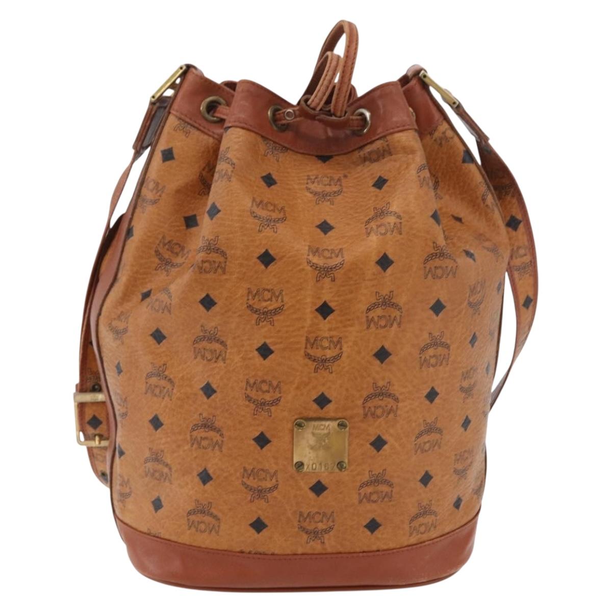 MCM Vicetos Logogram Drawstring Bag Bag PVC Leather Brown Gold Auth BA12441A