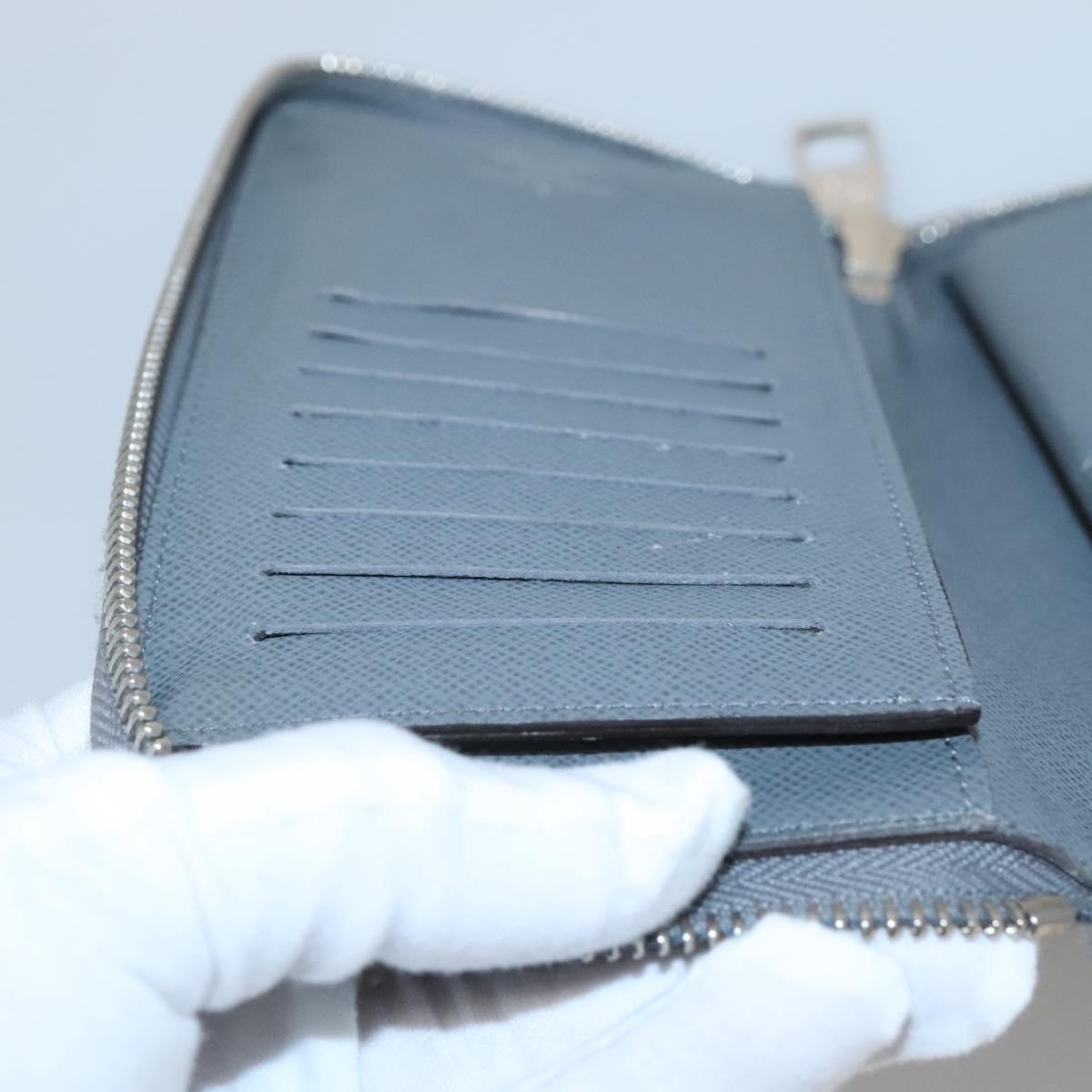 LOUIS VUITTON Taiga Zippy Wallet Vertical Gray Gracie M32601 LV Auth bs25700